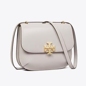 SOLD OUT…NWT Tory Burch Eleanor saddle crossbody bag. Grey with brown interior